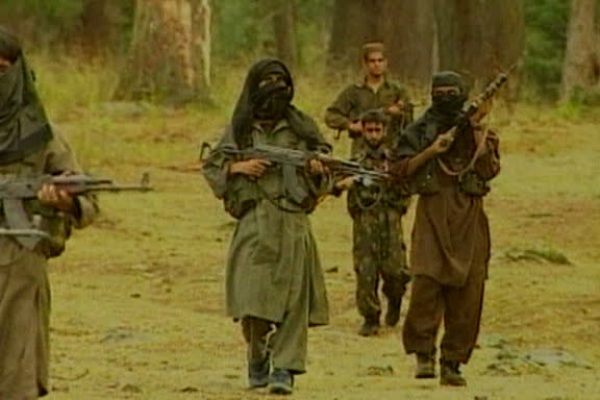 Kashmir militant rebels with hidden identity carry AK 47's patrolling near forest Kashmir; 2001 (Core Number: M:ANDN207H)